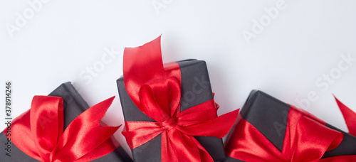Black friday sale flat lay with gift box and ribbon, copy space, christmas and holidays concept on white background