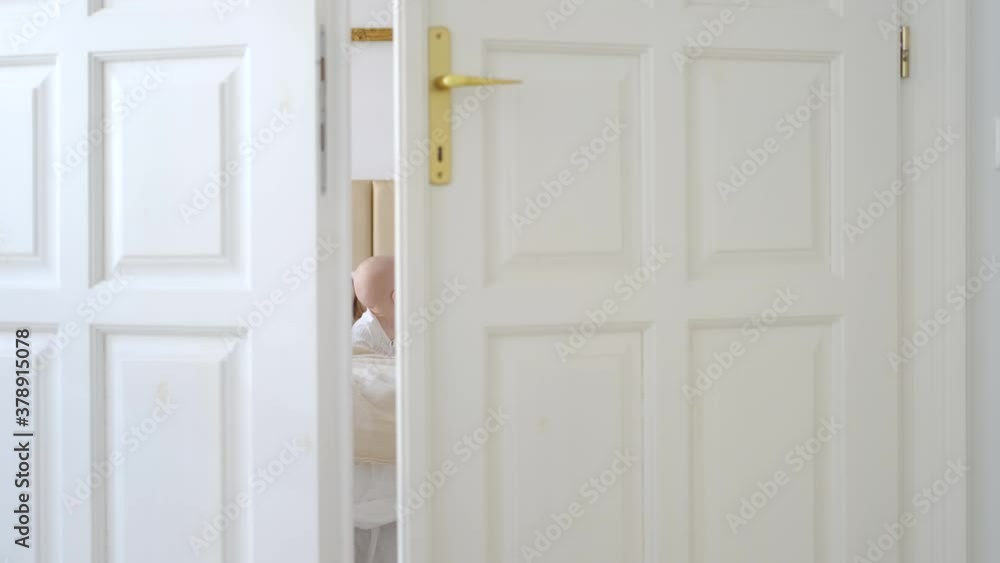 baby woke up next to sleeping mom in white bedroom baby woke up next to sleeping mom in white bedroom