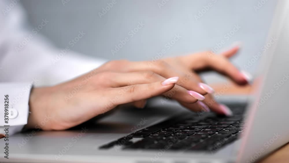Closeup female employee hands typing on keyboard use laptop at office. Shot with RED camera in 4K Closeup female employee hands typing on keyboard use laptop at office. Shot with RED camera in 4K