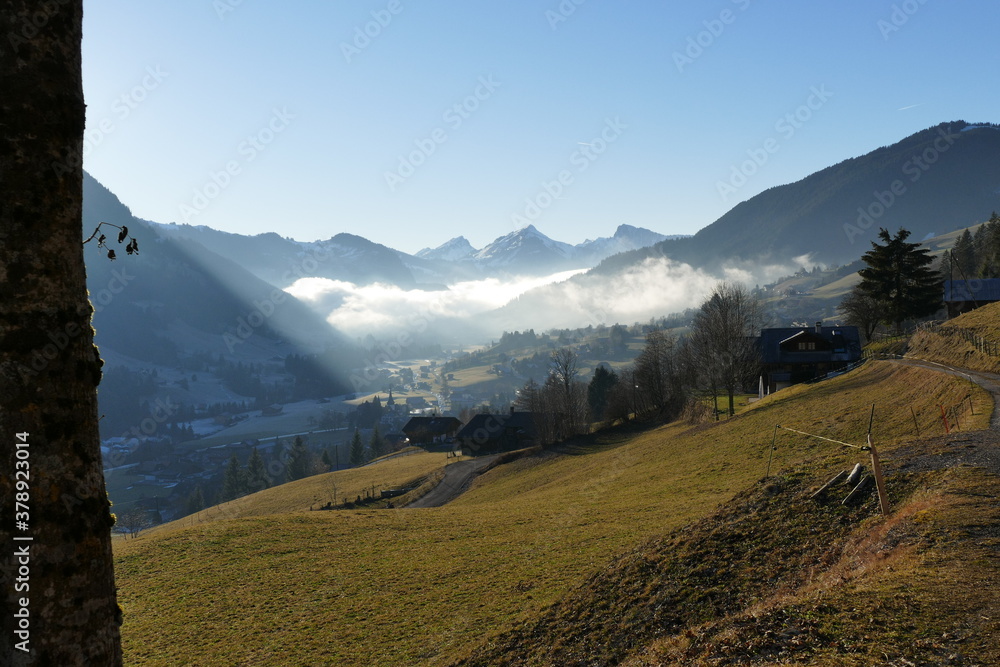 Fog rolls into the valley in Rougemont, Switzerland