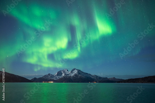Aurora borealis over mountains in Arctic Norway