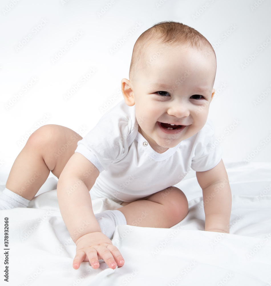 Photo of crawling eleven-month-old baby on a white background Photo of crawling eleven-month-old baby on a white background