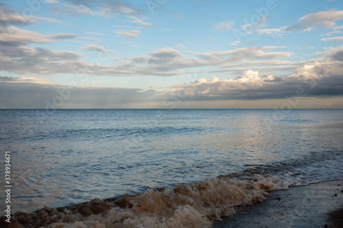 Wallpaper Mural Sand beach, sea and cloudy blue sky in England at sunset Torontodigital.ca