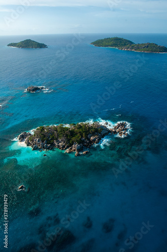 Aerial panorama of the Marine reserve of Coco island with the blue Indian Ocean  Seychelles