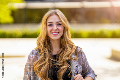 Portrait of attractive young woman outdoors 