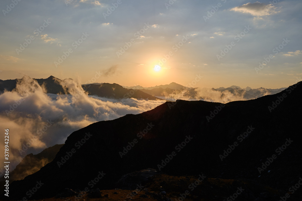 Sunrise in the mountains above the clouds. Arkhyz, Russia