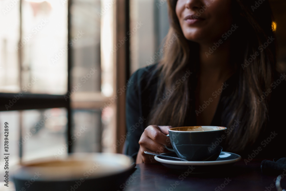 Young woman in coffee shop smiling