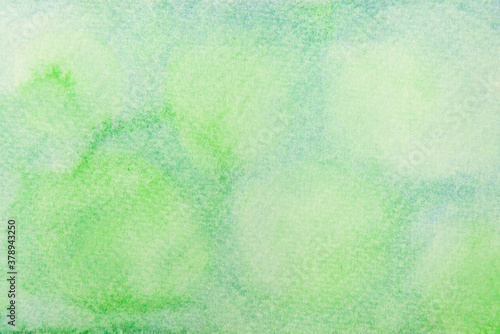 Abstract hand painted blue and green watercolor texture background.