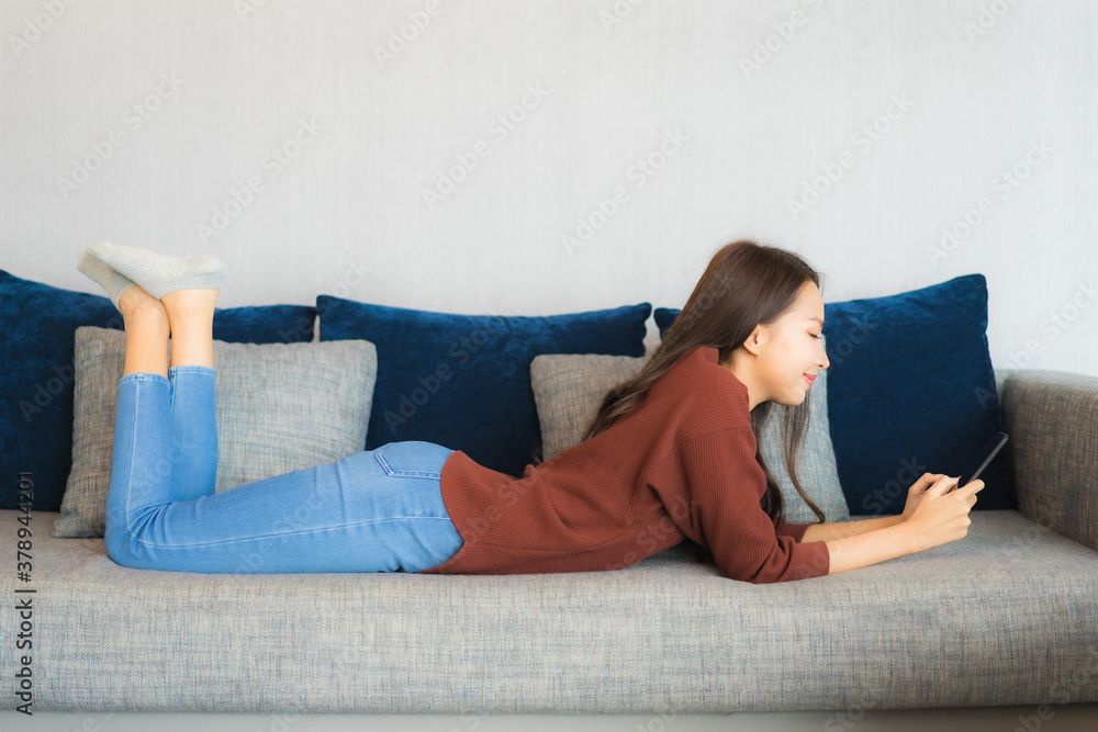 Portrait beautiful young asian woman use smart phone on sofa Portrait beautiful young asian woman use smart phone on sofa