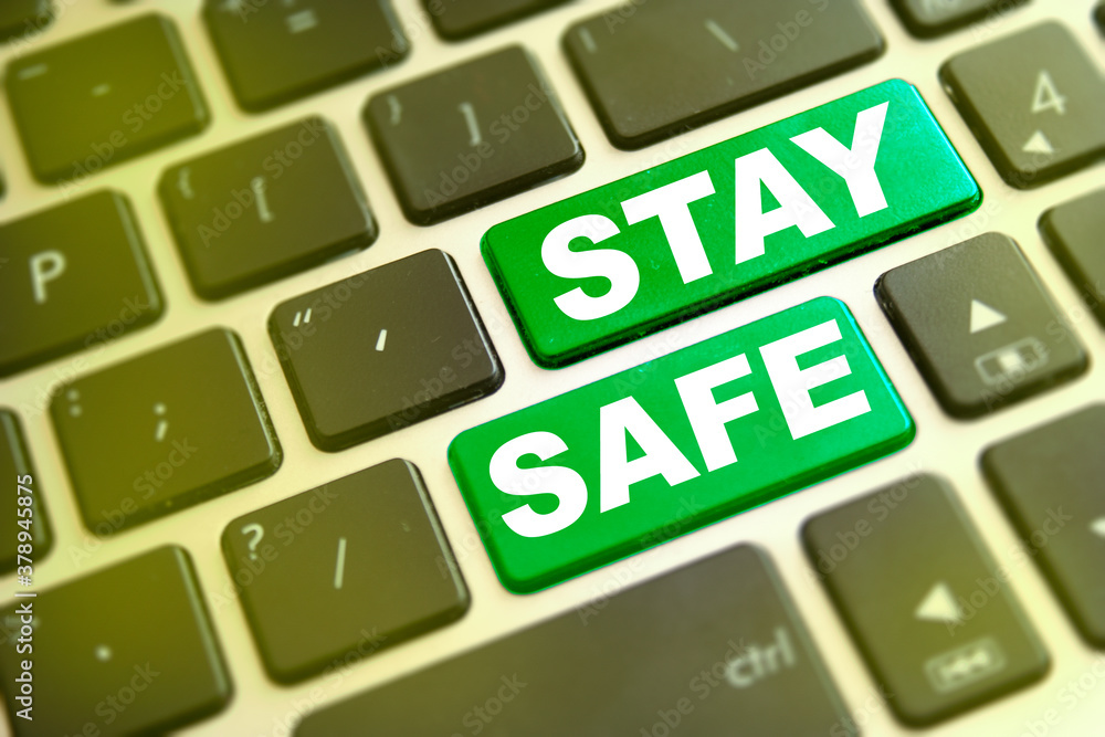 Note STAY SAFE writting on green button on computer keyboard. Stay safe key on computer keyboard prevention message Note STAY SAFE writting on green button on computer keyboard. Stay safe key on computer keyboard prevention message