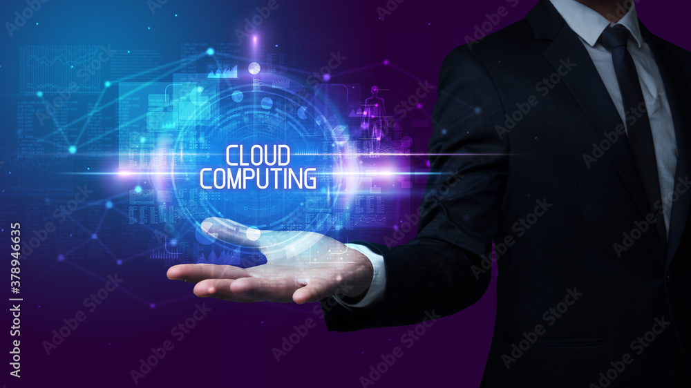 Man hand holding CLOUD COMPUTING inscription, technology concept Man hand holding CLOUD COMPUTING inscription, technology concept