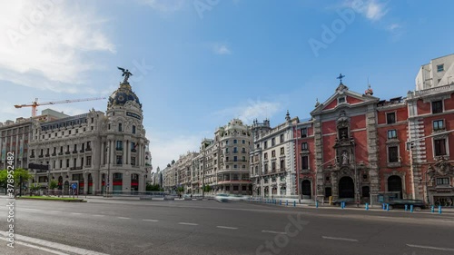 Madrid city center timelapse of traffic near famouse Metropolis building on Gran Via street