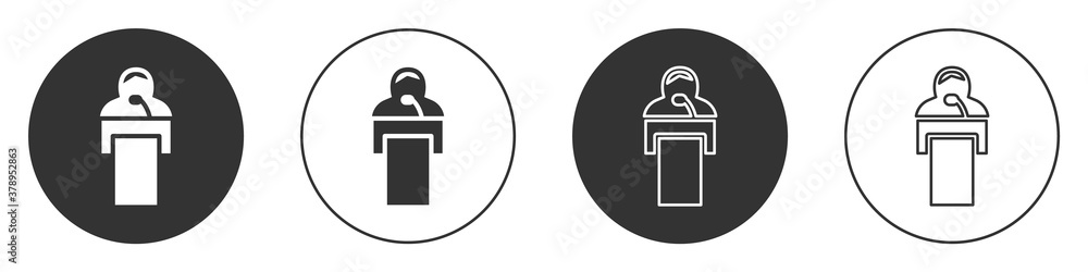 Black Gives lecture icon isolated on white background. Stand near podium. Speak into microphone. The speaker lectures and gestures. Circle button. Vector. Black Gives lecture icon isolated on white background. Stand near podium. Speak into microphone. The speaker lectures and gestures. Circle button. Vector.