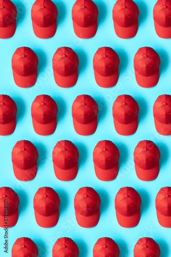 Knolling Red Hats on Blue Background Directly from above