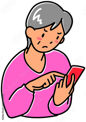 怒ったでスマホをさわるシニア女性
