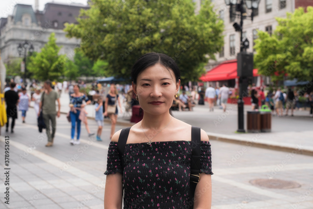 An attractive chinese woman traveling in Old Montreal