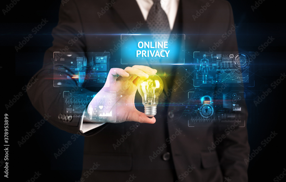 Fototapeta premium Businessman holding lightbulb with ONLINE PRIVACY inscription, online security idea concept