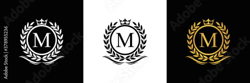 Golden Letter M laurel wreath template logo Luxury gold letter with crown. Monogram alphabet . Beautiful royal initials letter.	