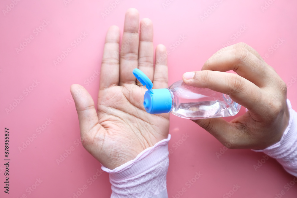 women hand using sanitizer gel for preventing virus with copy space women hand using sanitizer gel for preventing virus with copy space
