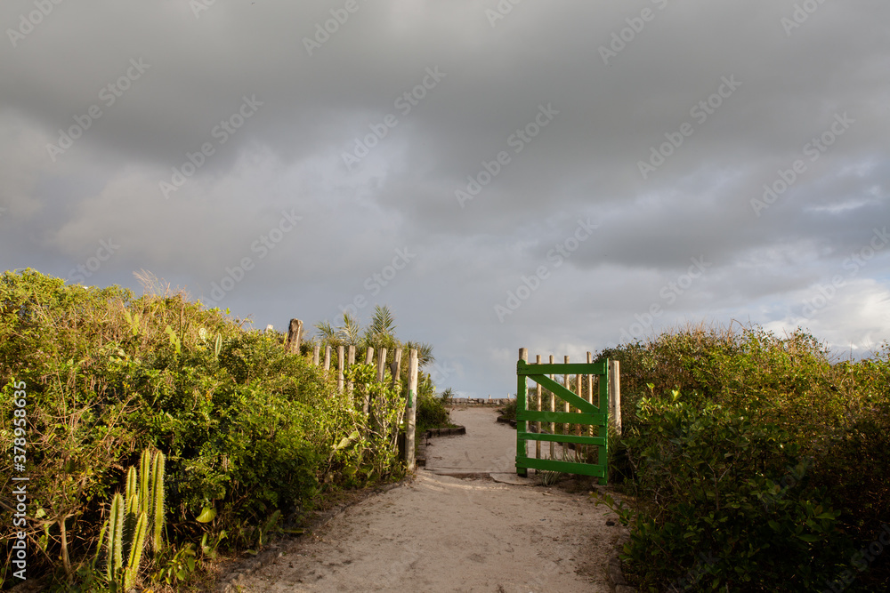Gate to the beach located in Praia do Recreio dos Bandeirantes Ecological Reserve, Rio de Janeiro, Brazil