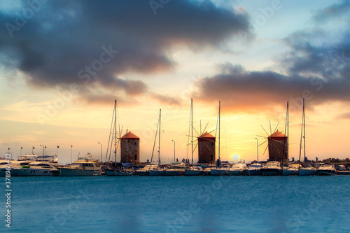 Obraz na płótnie Rhodes, Greece - July 3, 2020 - The port of Rhodes with its historic windmills w salonie
