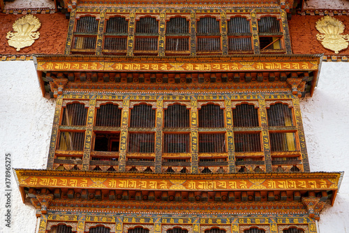 Bhutan,  city of Paro, wooden windows in the oldest temple of Bhutan, the Kyichu Lhakhang Temple. 