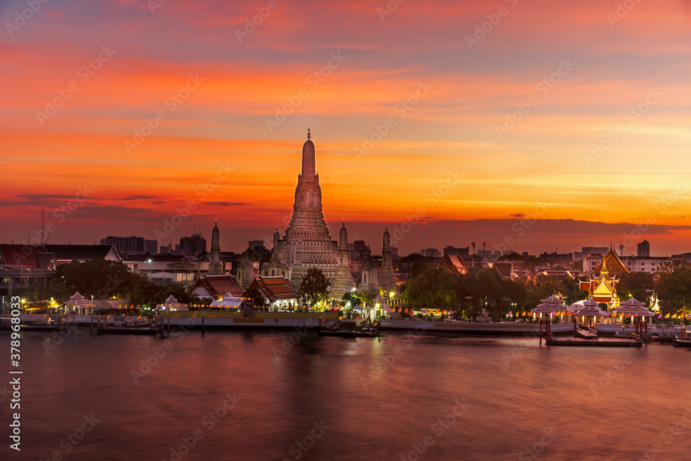 Wat Arun (Temple of Dawn) Famous temple on Chaopraya River . Beautiful view of Wat Arun Temple at sunset twilight landmark of Bangkok, Thailand
