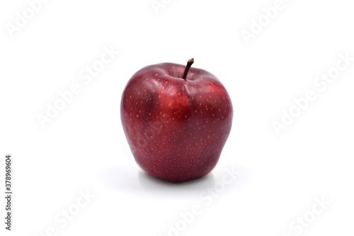 Red apple on the light background.