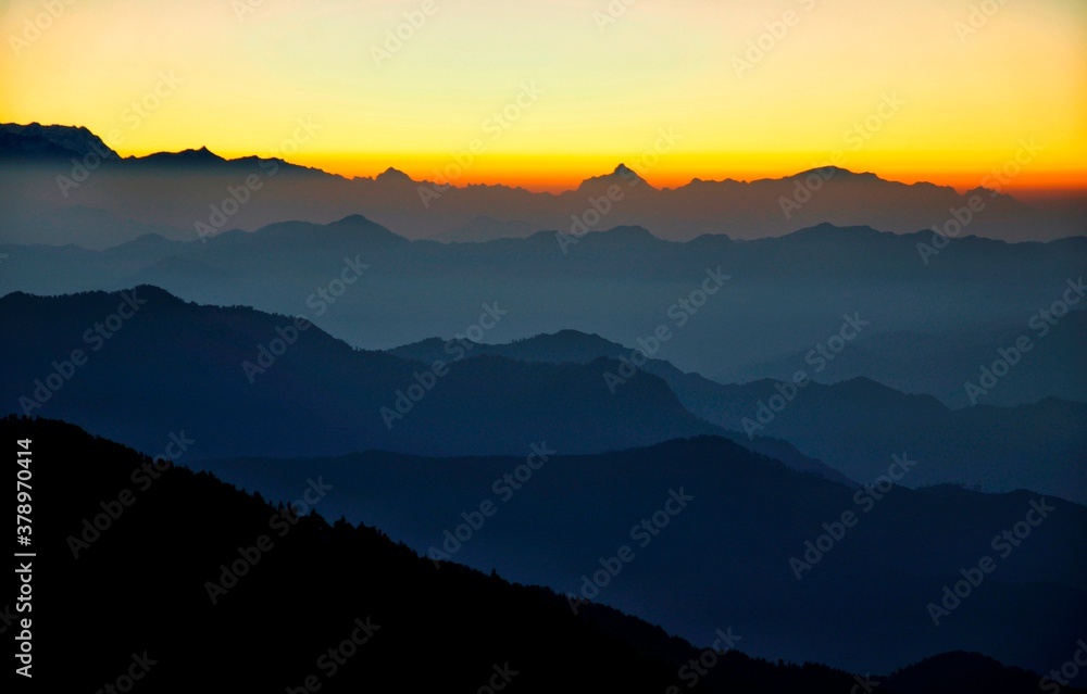 Sunrise with some of the Highest Peaks (Mt. Nanda Devi, Mt. Dronagiri and Mt. Trishul) situated in the Uttarakhand state of India. Picture clicked from Churdhar, Sirmour, Himachal Pradesh, India