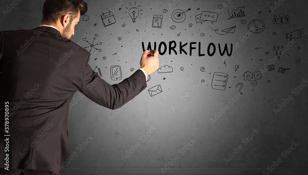 businessman drawing a creative idea sketch with WORKFLOW inscription, business strategy concept