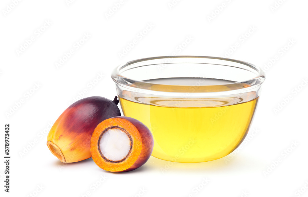 Oil Palm seed with cooking palm oil in glass bowl isolated on white background