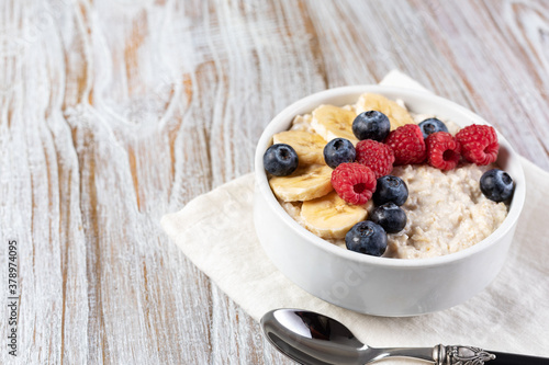 prepared oatmeal with fruits and berries