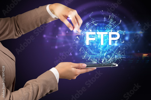 Close-up of a touchscreen with FTP abbreviation, modern technology concept