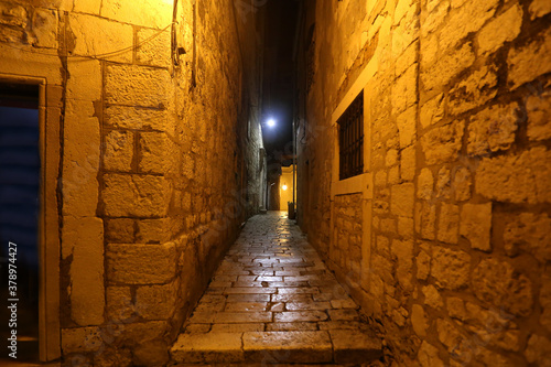 Narrow streets of Sibenik, old town in Croatia in the evening