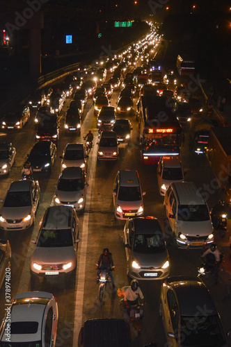 A view of traffic jam at night from the rooftop of bridge.