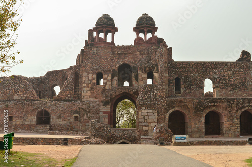 A mesmerizing view of architecture of small tomb at old fort from side lawn. photo