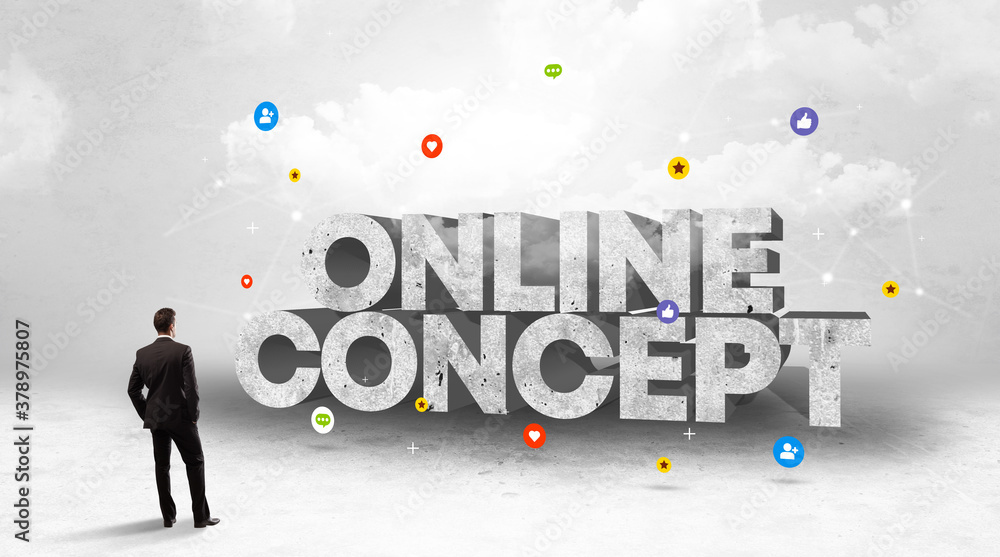 Young businessman standing in front of ONLINE CONCEPT inscription, social media concept Young businessman standing in front of ONLINE CONCEPT inscription, social media concept