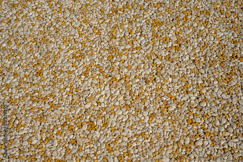 Fototapeta premium Tiny gravel texture on brown concrete wall. Texture background seamless gravel floor. High quality photo