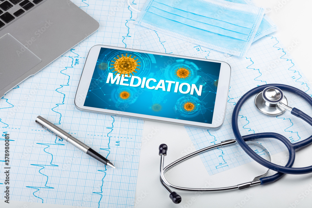 Close-up view of a tablet pc with MEDICATION inscription, microbiology concept Close-up view of a tablet pc with MEDICATION inscription, microbiology concept