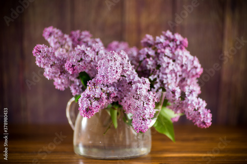 Wallpaper Mural bouquet of beautiful spring flowers of lilac on the table Torontodigital.ca