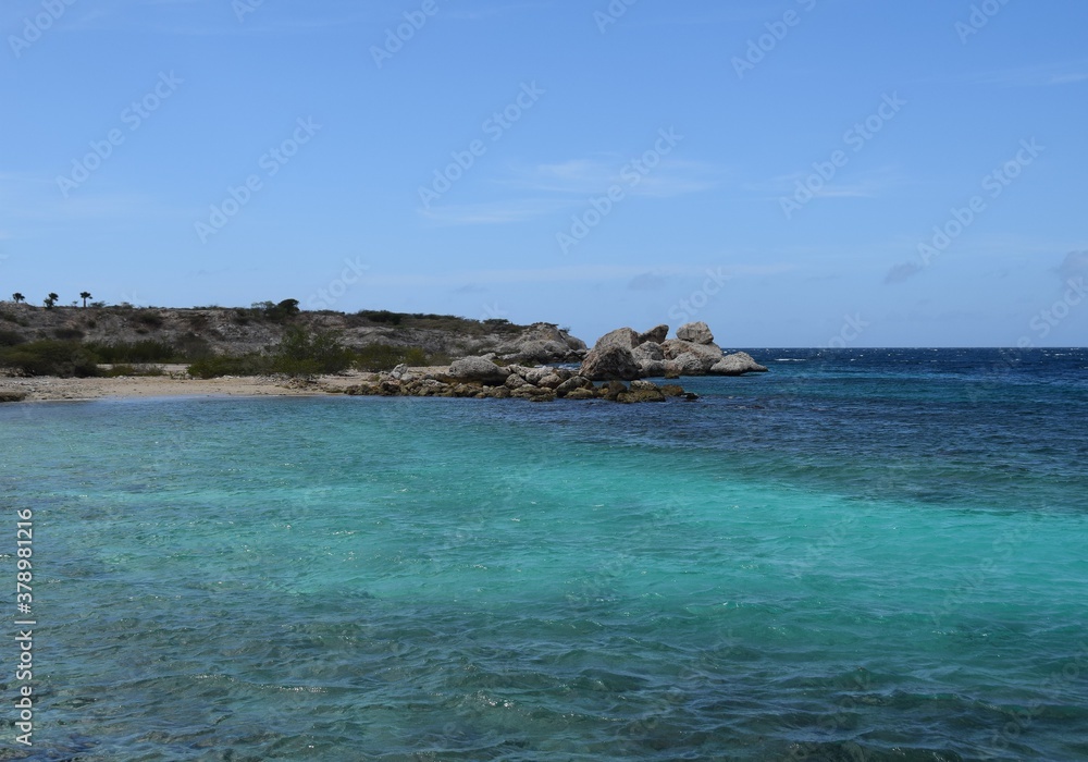 Rocks and turquoise water in the Caribbean sea blue sky coastal landscape along the Curacao coastline
