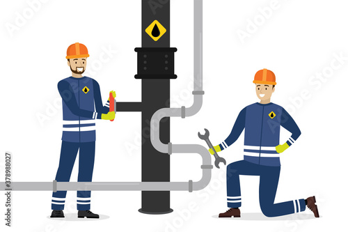 Happy oilman turns pipeline valve. Man worker uses wrench. Oil industry, workers in special clothing and helmet. Renovation work.