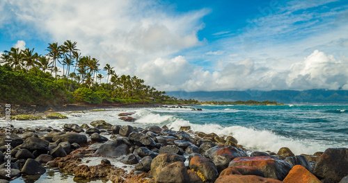 Marvelous shore. Large boulder among the waves in the sea. Hawaii