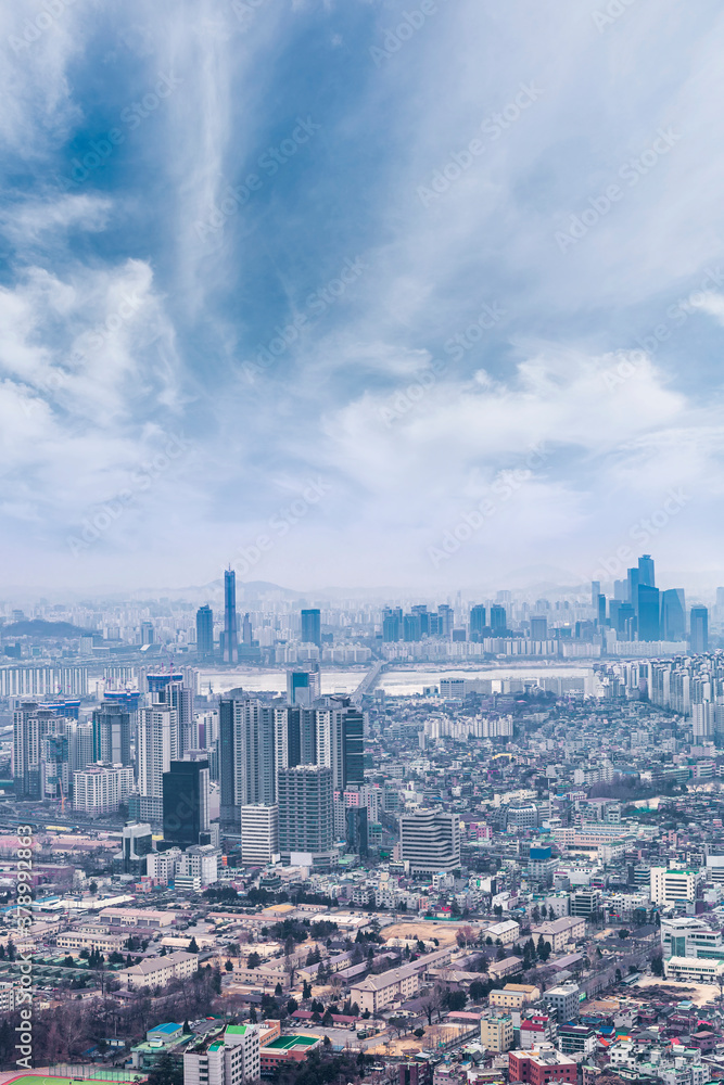 Seoul cityscapes with high rise office buildings and skyscrapers in Seoul city, Republic of Korea in winter blue sky and cloud