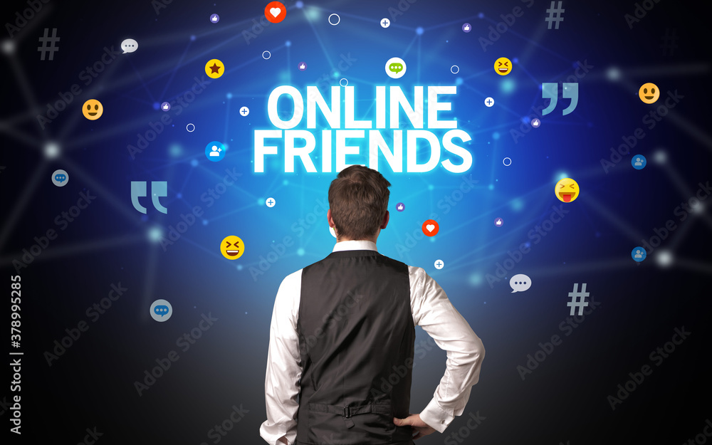 Rear view of a businessman with ONLINE FRIENDS inscription, social networking concept Rear view of a businessman with ONLINE FRIENDS inscription, social networking concept