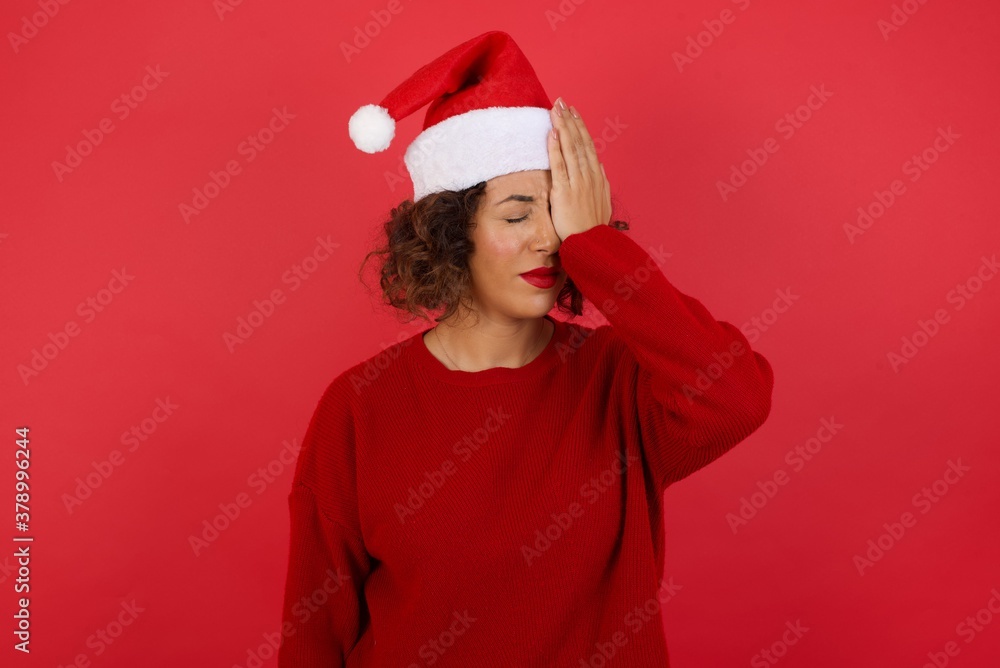 Frustrated brunette woman wearing casual clothes holding hand on forehead, frowning her face, being depressed having headache.