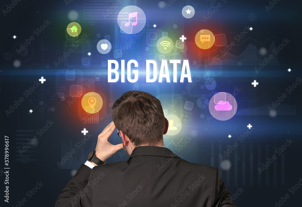 Rear view of a businessman with BIG DATA inscription, modern technology concept Rear view of a businessman with BIG DATA inscription, modern technology concept
