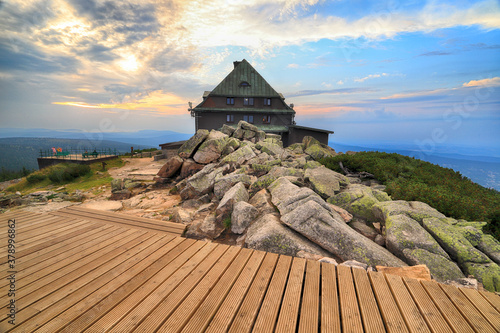 Fototapeta Naklejka Na Ścianę i Meble -  SZKLARSKA POREBA, POLAND - AUGUST 10, 2020: Szrenica mountain shelter (1362 m above sea level) during sunset, Szklarska Poreba, Poland, Europe.