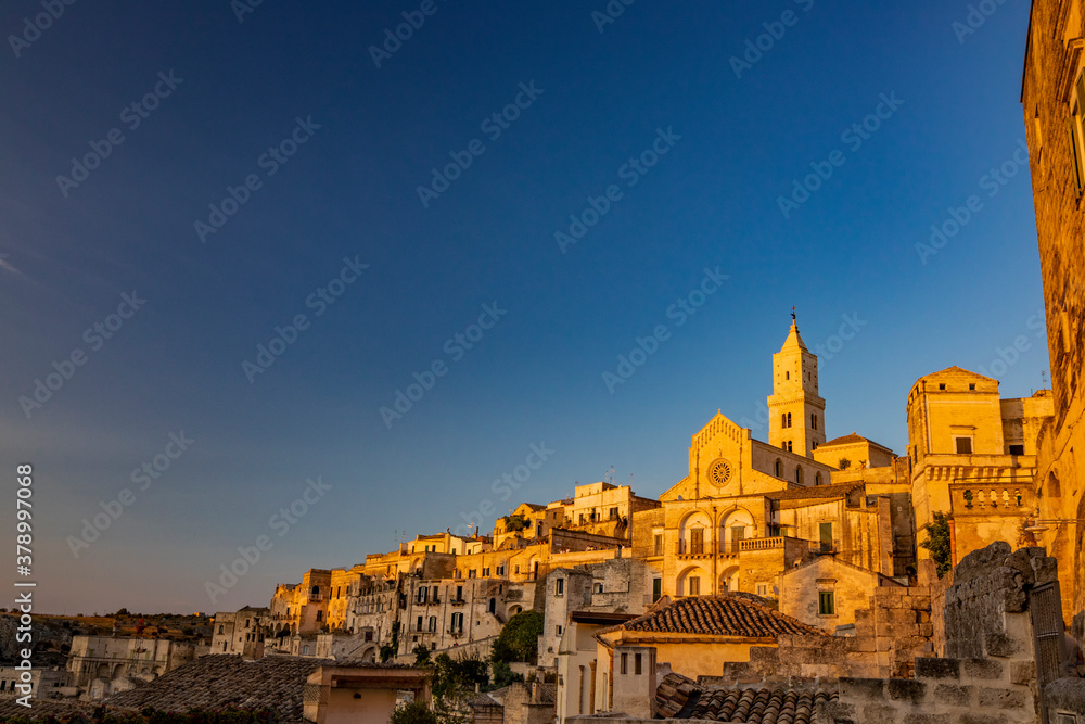 Matera, Basilicata, Italy - The Cathedral of Madonna della Bruna and Sant'Eustachio, built in the Apulian Romanesque style in Civita. The facade illuminated by the sunset light.