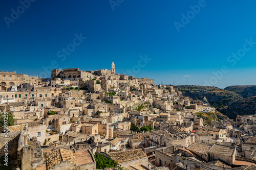 Matera  Basilicata  Italy - Panoramic view from the top of the Sassi of Matera  Barisano and Caveoso. The ancient houses of stone and brick  carved into the rock. The ravine in the background.